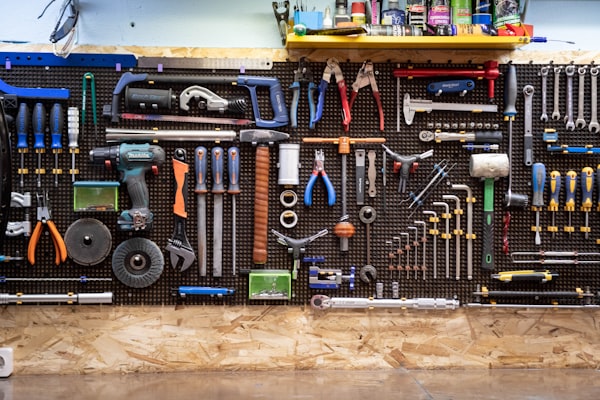 Plumbing tools organized on wall